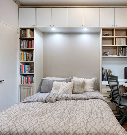 Wall bed seamlessly integrated into a modern room setting, highlighting DELTA CAINA's space-saving furniture hardware solutions and innovative invisible bed hinges.